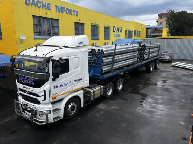 truck with mild steel pipes loaded and ready for delivery